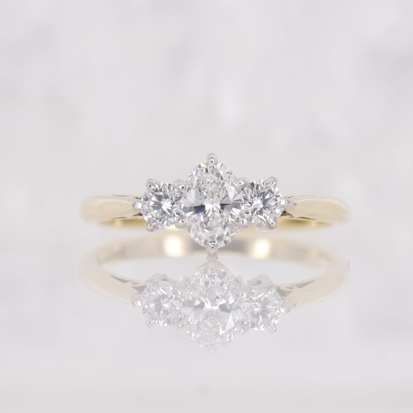 18ct yellow gold oval diamond engagement ring. Three stone oval diamond engagement ring.
