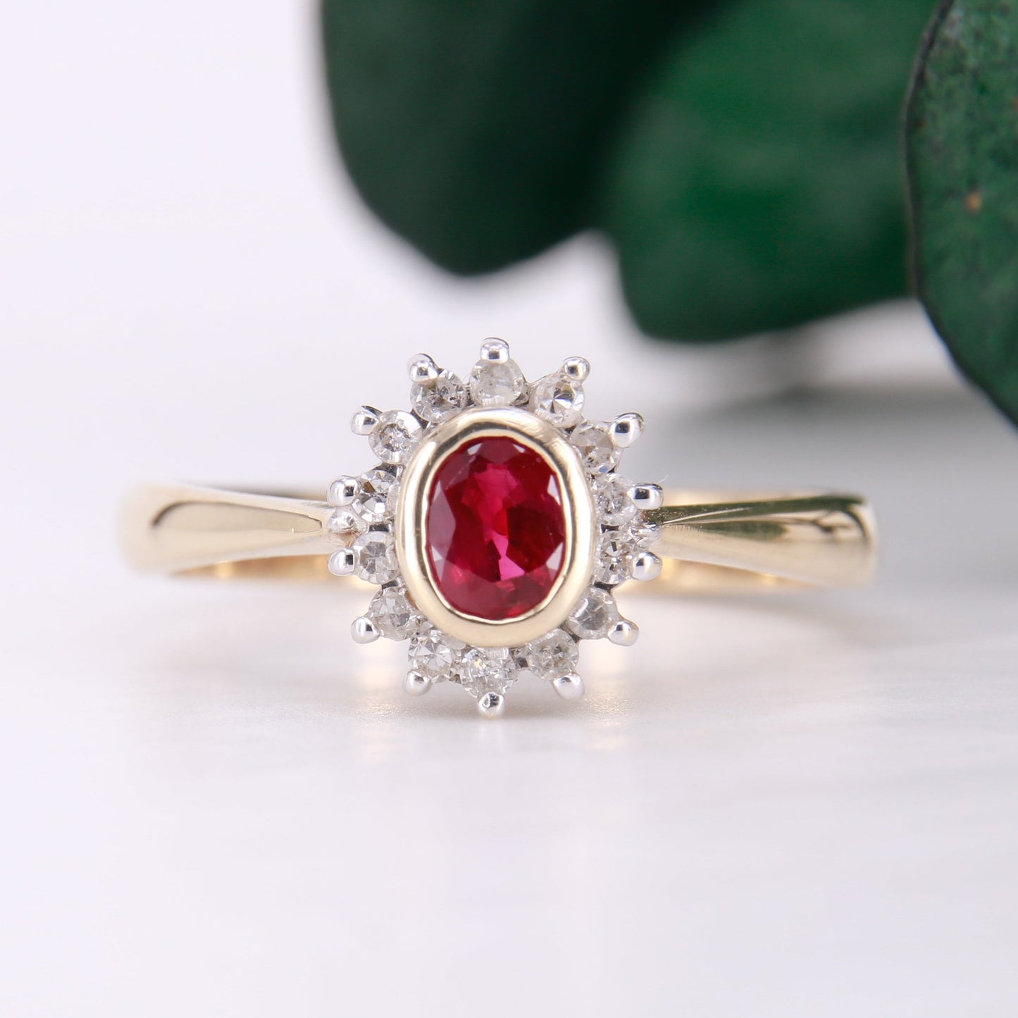 Vintage Garnet and Diamond Ring, Oval Cut Garnet surrounded by a halo of diamonds set in 9ct yellow gold. January birthstone engagement ring.