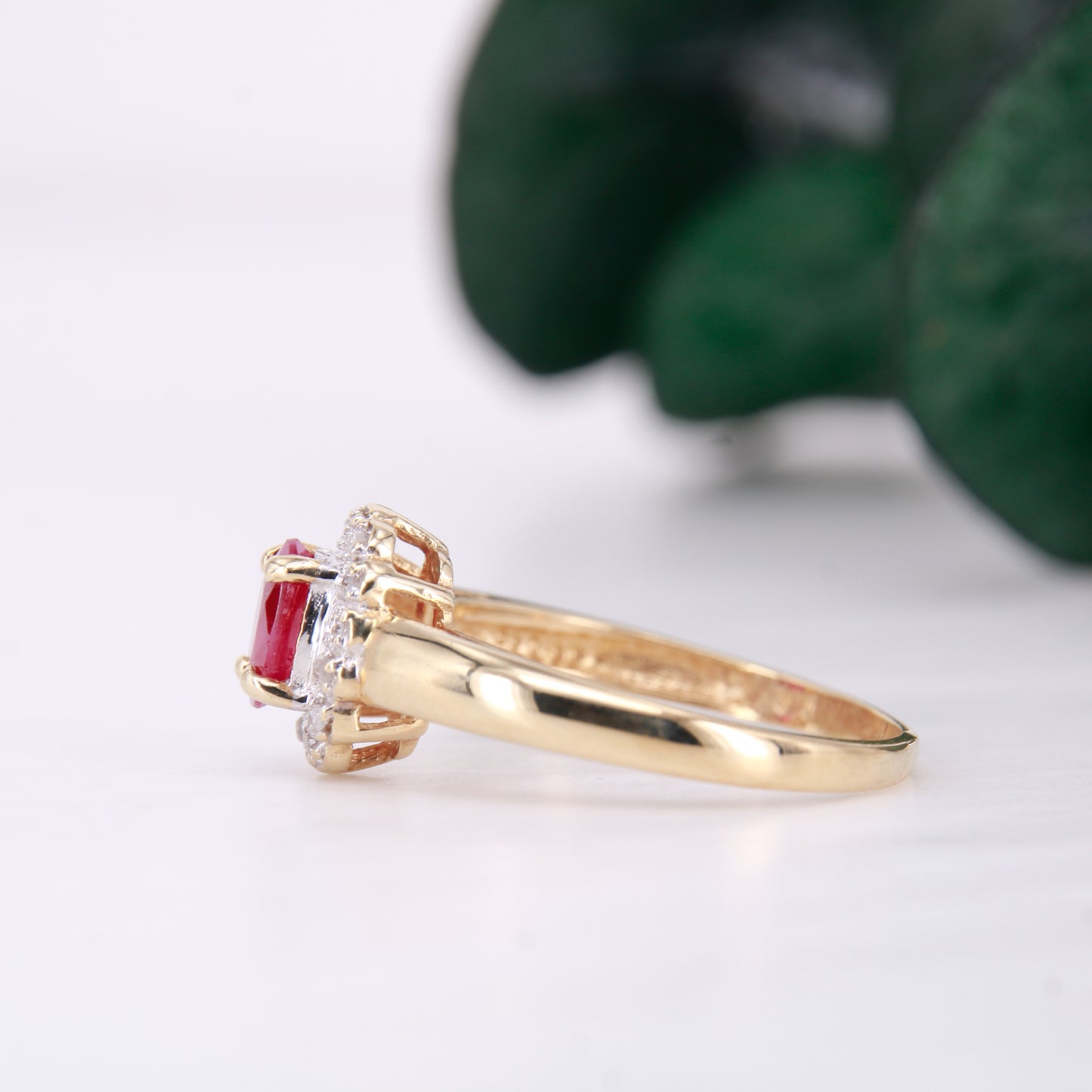 Secondhand Vintage Garnet and Ring. Halo cut Garnet with a halo of diamonds, set in 9ct gold.