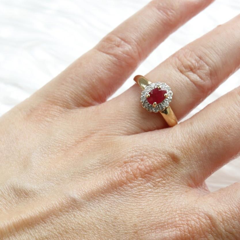 Secondhand Vintage Garnet and Ring. Halo cut Garnet with a halo of diamonds, set in 9ct gold.