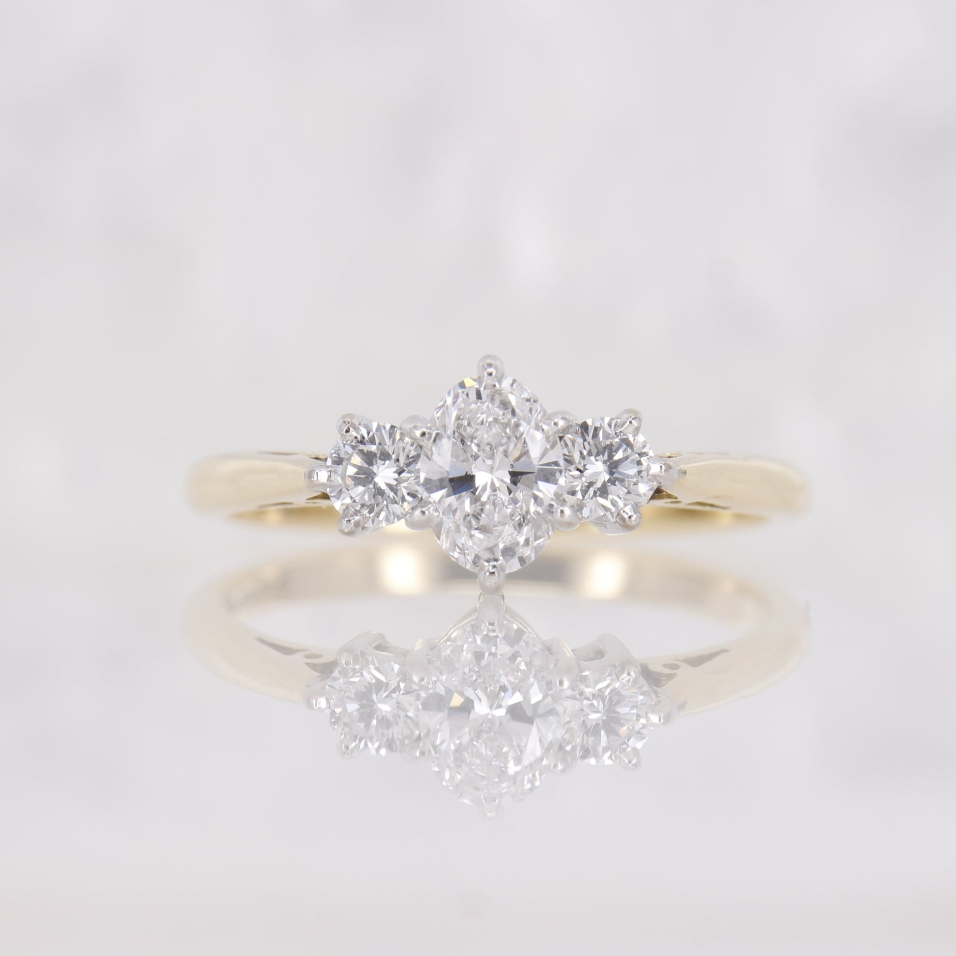 18ct yellow gold oval diamond engagement ring. Three stone oval diamond engagement ring. 