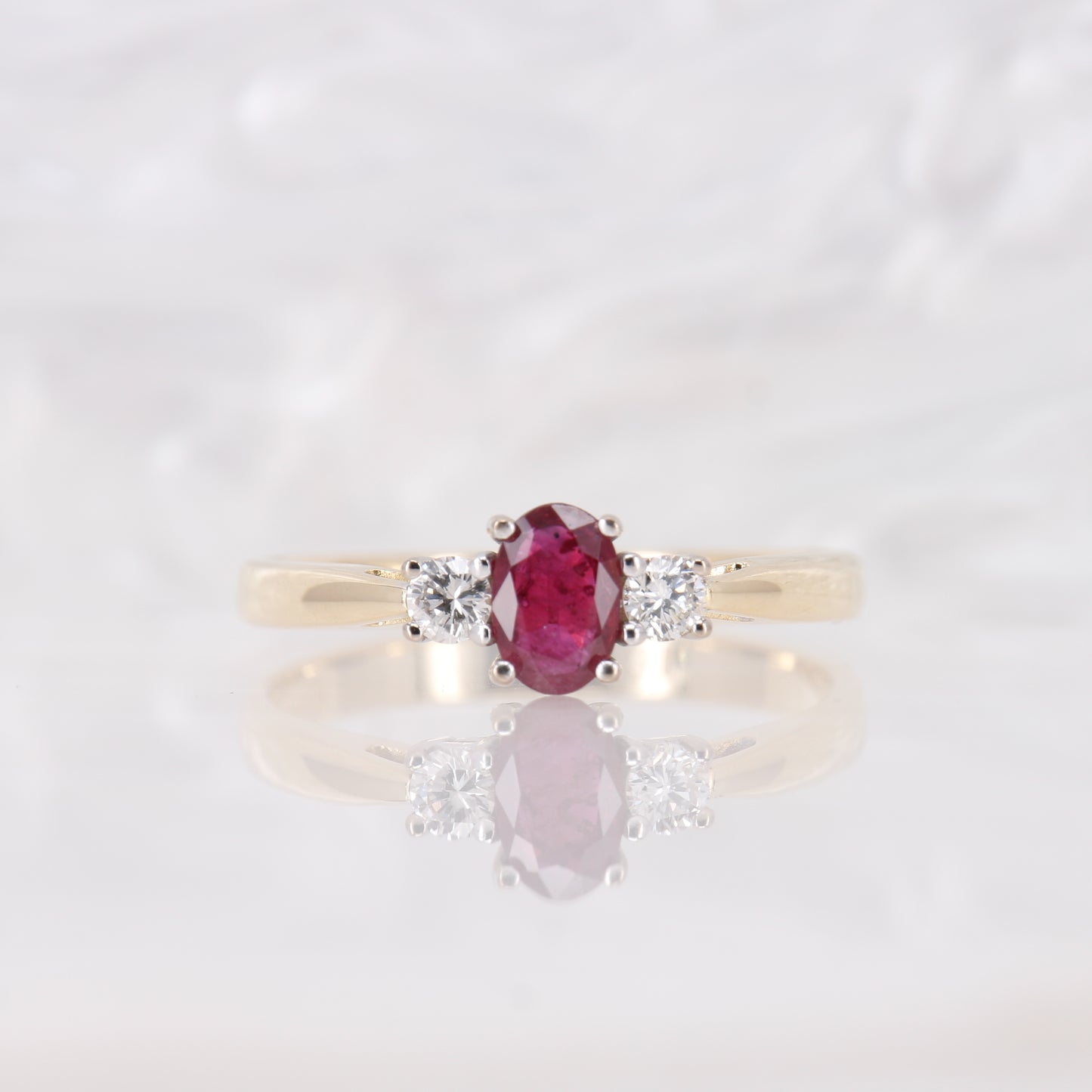 Oval cut Ruby and Diamond Trilogy Three Stone Engagement Ring