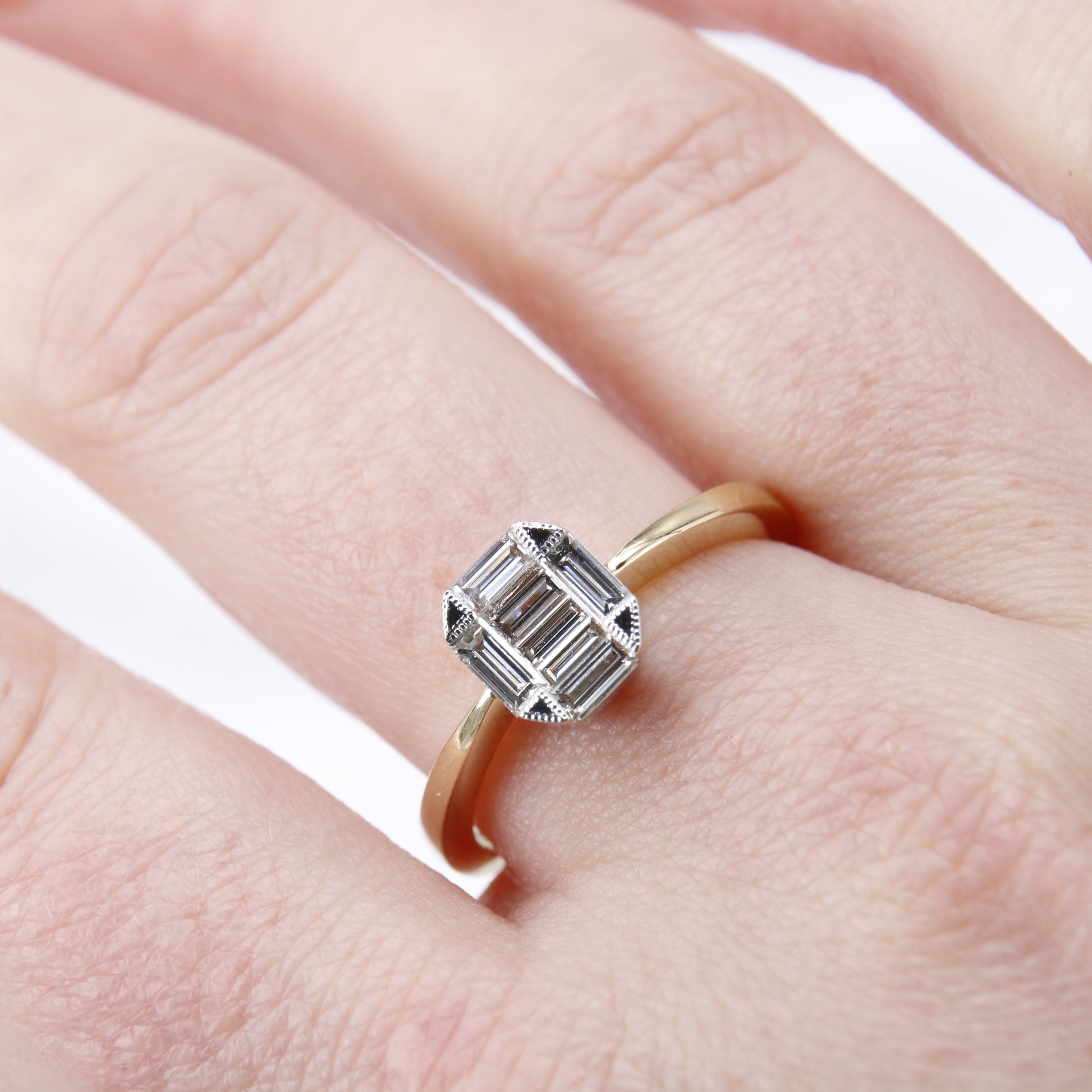 Pre-Owned baguette cut diamond cluster ring, featuring 7 stunning baguette cut diamonds set in a hexagonal shape. Perfect as a vintage inspired engagement ring.