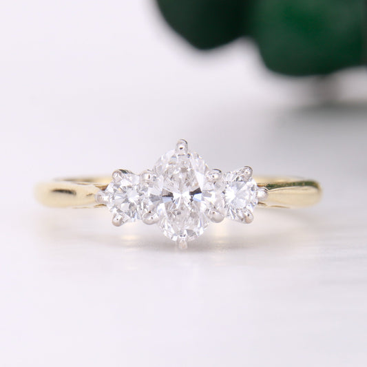 18ct yellow gold oval diamond engagement ring. Three stone oval diamond engagement ring. 